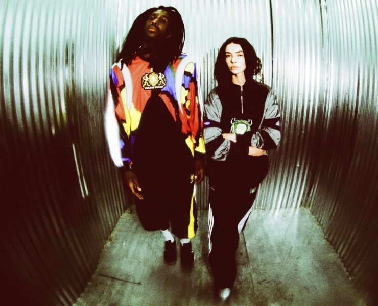 Having previously partnered on a number of collaborative collections, including takes on Tennis culture, Japanese Wrestling style, and a selection of iconic adidas silhouettes, this December, Brain Dead and the brand with the Three Stripes return to present a head-to-toe nostalgic capsule. Channeling the bold sporting and video game energy of the 2000s, the latest adidas Originals x Brain Dead collection delivers a full head-to-toe offering. The collection features reflective silver elements and shaped panels inspired by the adidas archive for apparel, along with two standout retro-futuristic silhouettes, also inspired from the adidas archive, complemented by matching accessories. The apparel offering boasts a number of key pieces, including a Japanese Noragi inspired Climacool track top and matching track pants, a metallic football-esque jersey and matching shorts, and an all over print goalkeeper jersey, as well as a track top, track pants, and a t-shirt. Each piece features Brain Dead graphics and custo crests. Rounding out the collection in the form of accessories are a sling bag and beanie. The footwear selection focuses on two silhouettes: the Climacool 2 and the Taekwondo Mei. Born in 2003 as the followup to the OG adidas Climacool sneaker, the Climacool 2 saw the silhouette updated with a futuristic vent system. Now, Braindead has brought its distinct aesthetic sensibility to the silhouette, featuring metallic vents, reflective green mesh, and yellow accents. The Taekwondo Mei Brain Dead, meanwhile, features a black upper with white stripes and an off-white outsole. Brain Dead and adidas Originals have produced a line of two collectibles inspired by classic video game culture, blending nostalgic aesthetics with the brand’s signature surreal style. These limited-edition figures capture the playful, experimental spirit of the early 2000s and will be raffled exclusively on CONFIRMED, running for the duration of the collection’s availability. While the collection can be purchased directly, the collectibles can only be won via raffle. Arriving in limited quantities on December 18th, the adidas Originals x Brain Dead collection is available via CONFIRMED, select adidas stores, select retailers, and on wearebraindead.com.